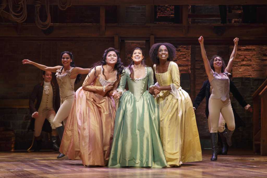 Photo courtesy Chicago Sun-Times. Karen Olivo (right), Ari Afsar (middle) and Samantha Marie Wright (left) star as the trio of sisters, Angelica, Eliza, and Peggy Schuyler, respectively.