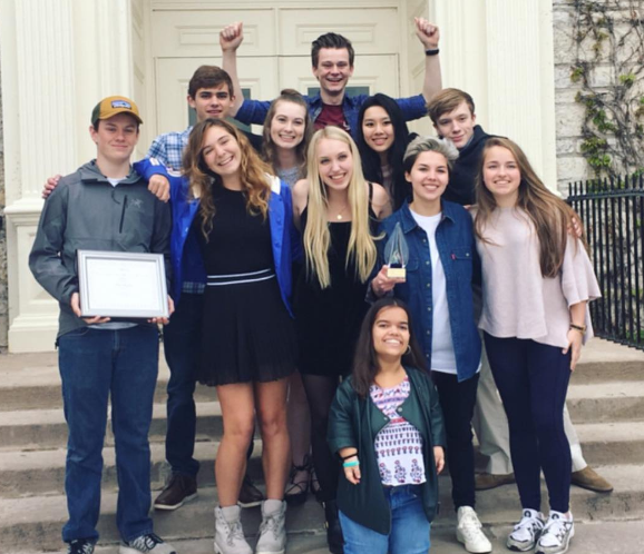 A group of people posing for a photo