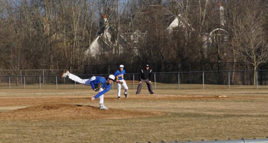 Michael Vallone delivers a pitch in a March game against Lane Tech. Vallone has been a key member of this years young pitching staff.