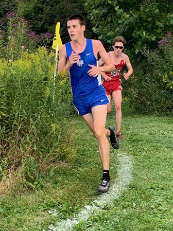 Senior Ben Rosa fends off competition at Lake County Invitational to win his first personal title for the Scouts in cross country. 
