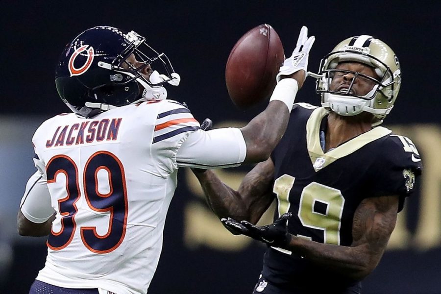 Eddie Jackson defends Ted Ginn as the Saints receiver tries to catch a pass.