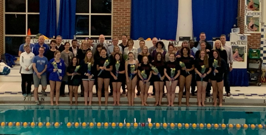 Senior swimmers, parents, and teachers gather to celebrate successful Scout swim careers.
