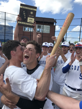 Peter Turelli (6) and Connor Morrison (21) celebrate the teams Regional championship over Lake Zurich on May 25, 2019.