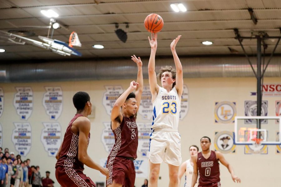 Jack Malloy puts up a jump shot during Tuesday nights contest against Zion-Benton. The junior scored 20 points and grabbed ten boards in the Scouts 56-54 loss
