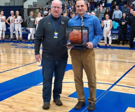 Wilhelm with head athletic director Tim Burkhalter prior to a game in 2019. He became the all-time winningest coach that season, leading the Scouts to a franchise record 27 wins.