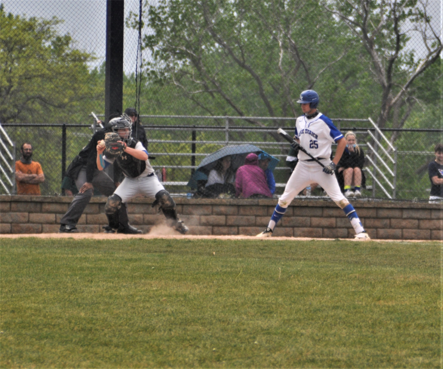 Senior catcher Rocco Royer throwing out Lake Zurich runner during the 4th inning on Tuesday 