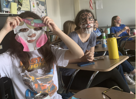 Juniors Sofia Davis and Rachel Kaus with animal print face masks. 