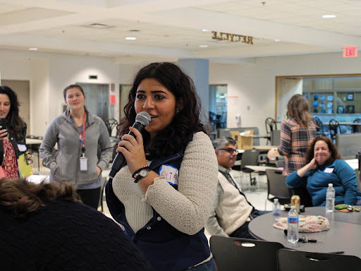 Senior Alia Attar, President of Human Rights Club, addresses the event's attendees