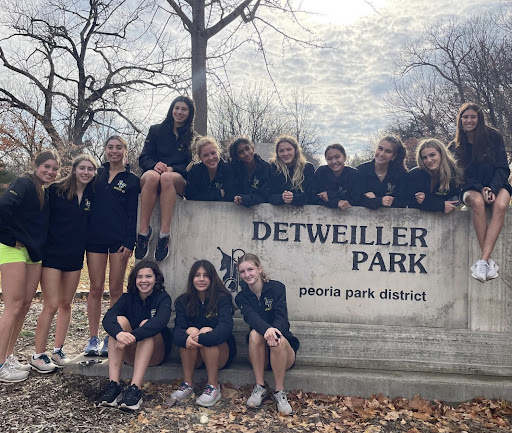 Girls cross country battles mud, wind, and torrential rain for 12th place finish at State