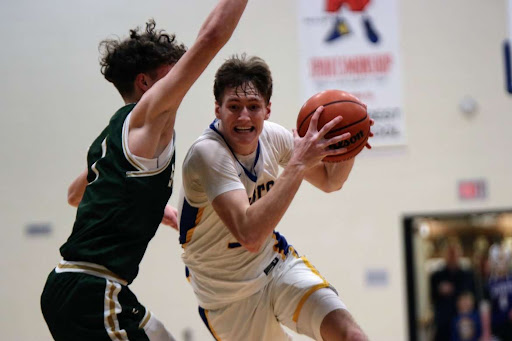 Asa Thomas drives to the basket in last night's game vs Stevenson.