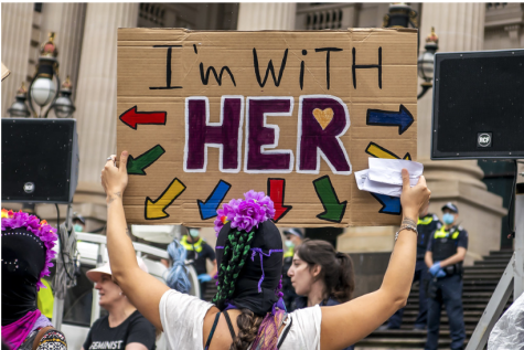 Participant holding a sign at the International Womens March 2021 in Melbourne
