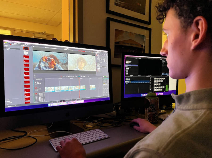 Junior Simon Pasquesi edits the teams film. The group had just seven days to write, act, and edit the film. 