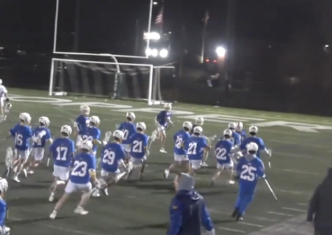 The Scouts rush the field after OT win against Glenbard West (Courtesy of Lax Hudl)