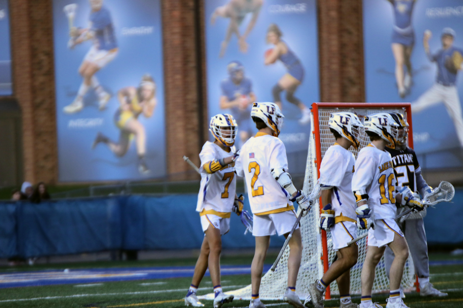 Lake Forest Mens Lacrosse celebrates a game tying goal early in the second quarter on Thursday night against Glenbrook South.