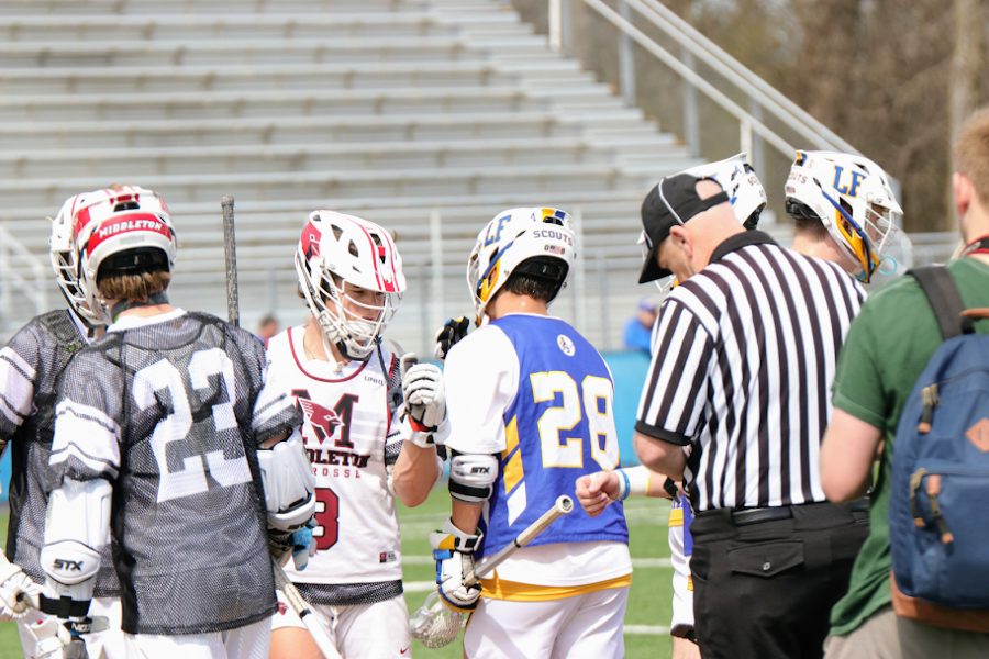 Lake Forest Lacrosse captains meet with Middleton captains before their game Saturday morning