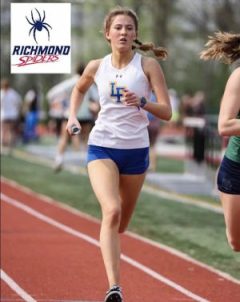 Senior Lucy Schlachtenhaufen running a track relay