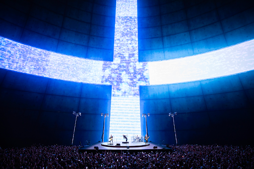 U2 began its set with Zoo TV and featured the sphere “opening” to massive video feeds of Bono and The Edge.