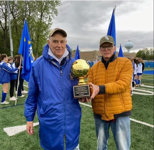 Photo courtesy of LFHS Athletic Office Facebook. Chouinard (left) next to friend and mentor Roger Hartman (right)