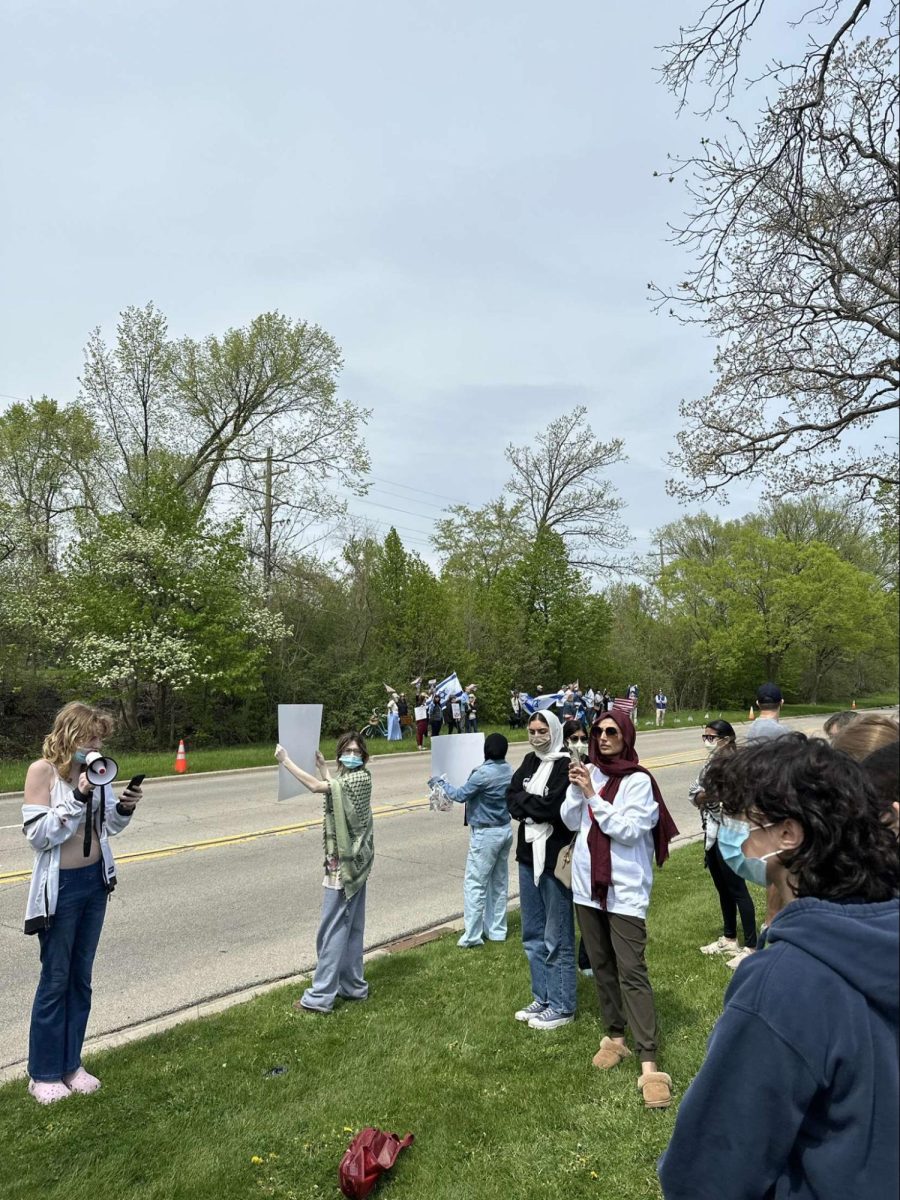 Lake Forest Students gathered in peaceful protest just outside LFHS’ front lawn. A group of opposing protestors are pictured in the back. Photo courtesy of AJ Bielski.