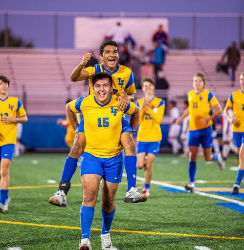  Ibrahim Hashim and Kashyap Prasad celebrate Ibrahim's goal against Waukegan.