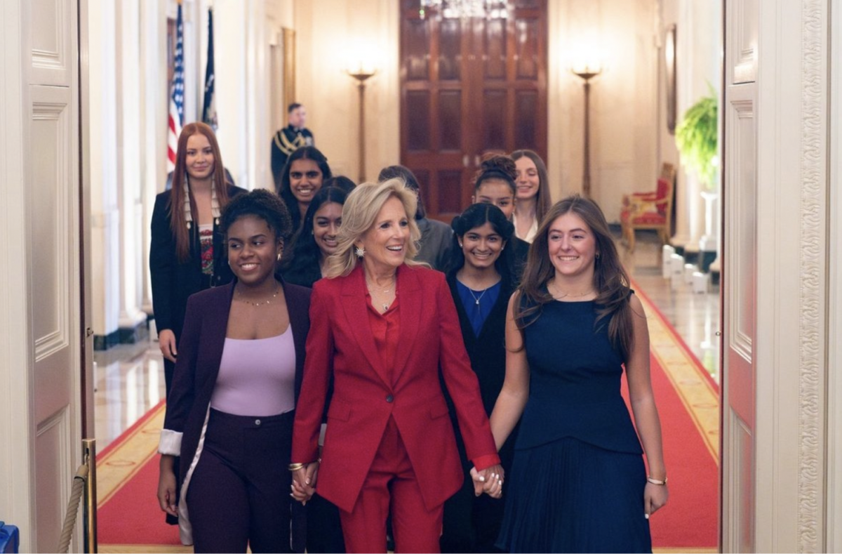 Demetrio walking with First Lady Jill Biden into the "Girls Leading Change" Ceremony at the White House