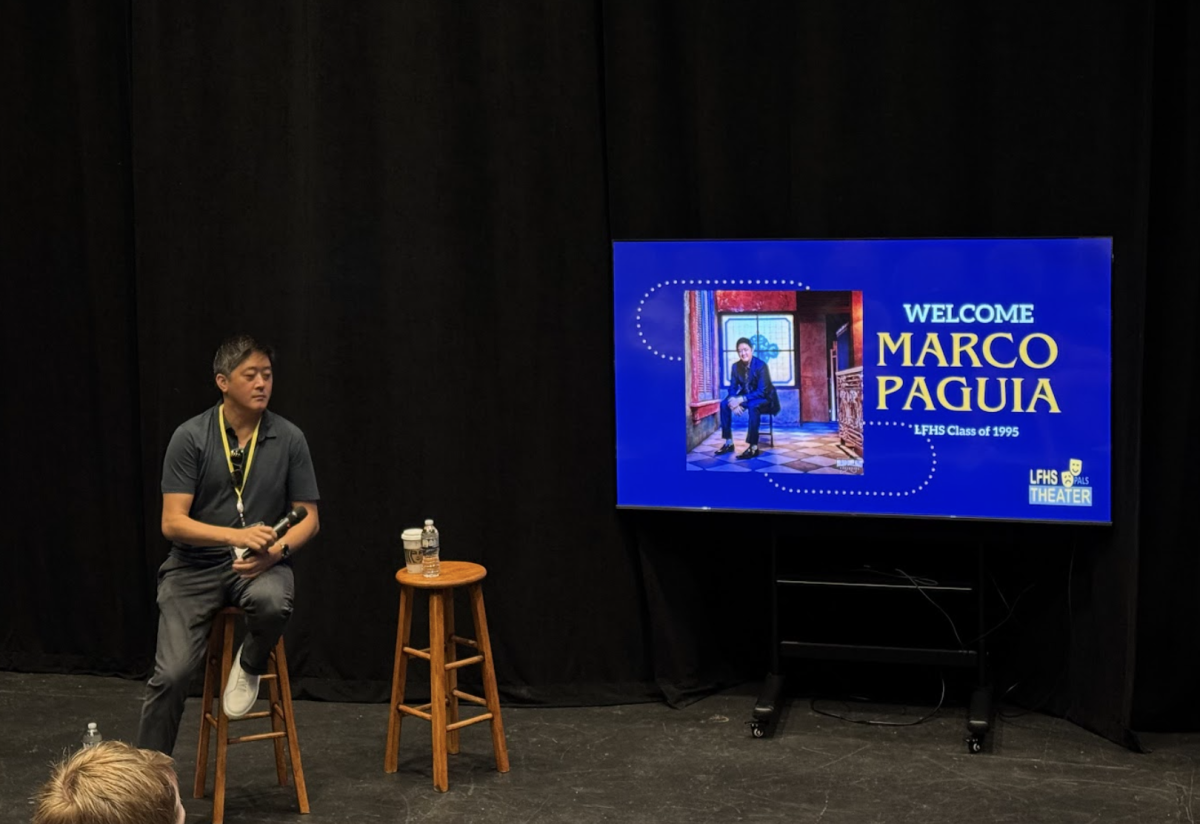 Marco Paguia at LFHS speaking to the performing arts and musical students