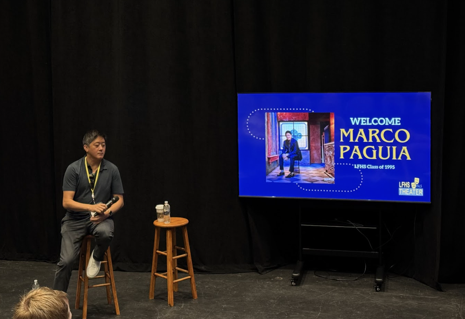 Marco Paguia at LFHS speaking to the performing arts and musical students