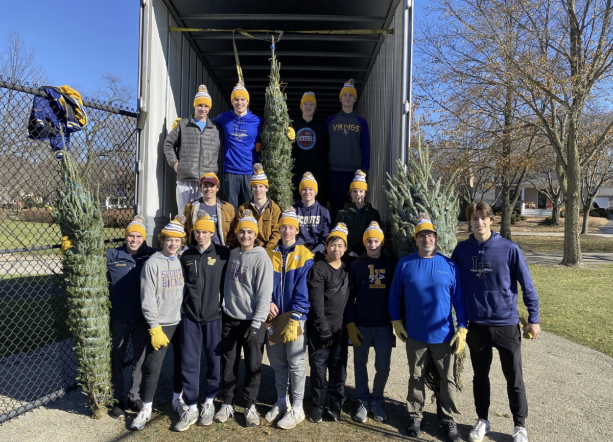 Scouts Hockey Team delivering Christmas trees. Courtesy of Lake Forest Scouts Hockey.