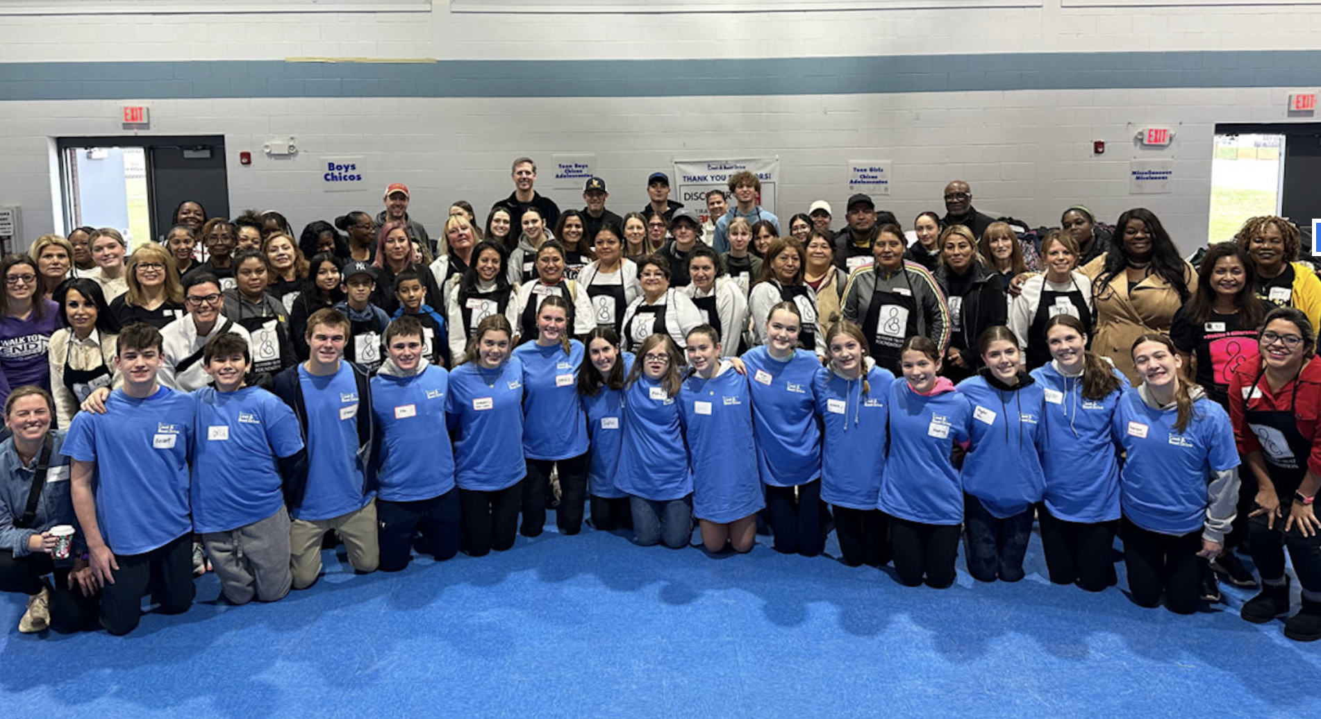 Volunteers organizing coats from the Mothers Trust Foundation annual coat drive.