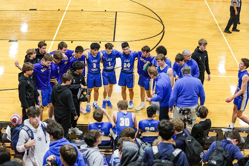 Taken of the team huddled together.