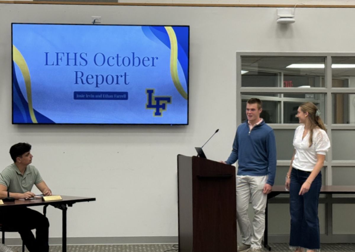 Irvin and Farrell at the October School Board Meeting presenting. (Photo courtesy of Josie Irvin).