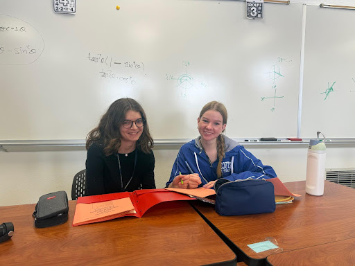 Sydney Keck and Paige Collister sitting in their assigned seats doing math together. Photo courtesy of Kylie Daum. 