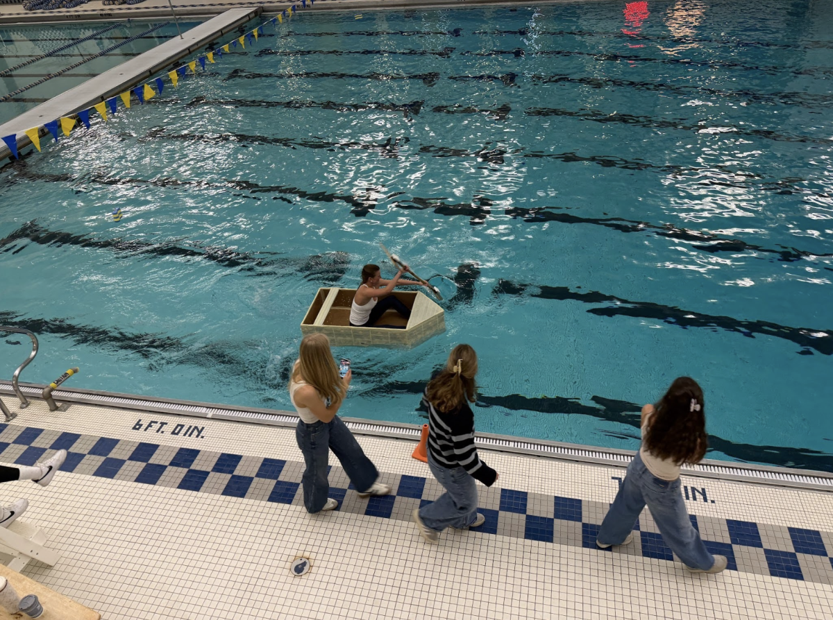 Student compete in the annual Boat Races, a physics experiment competition in the pool.